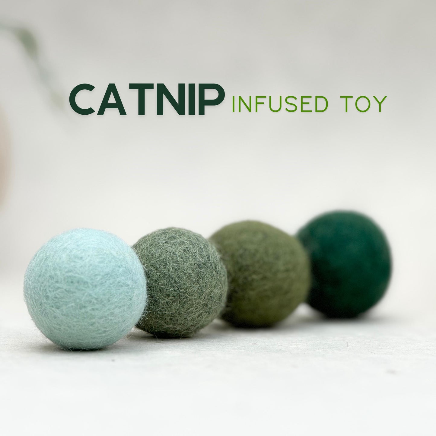 Minimal wool felt cat toy set - four handmade catnip-infused felt balls in tin, natural design for modern homes.